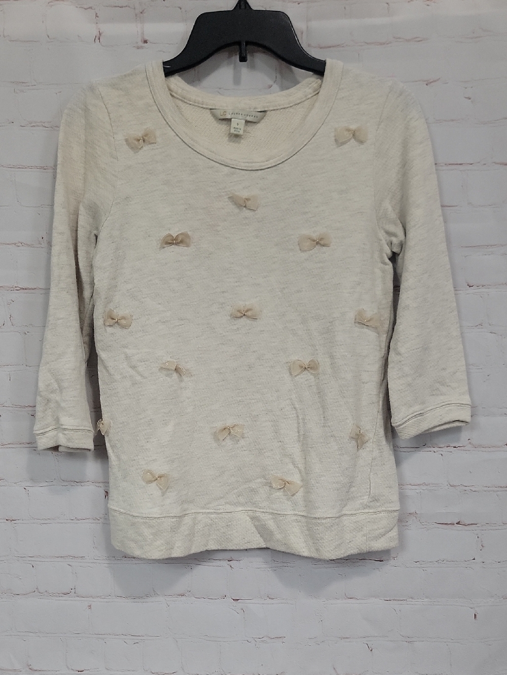 LC Lauren Conrad Cream Sweater with Bow Embellishments